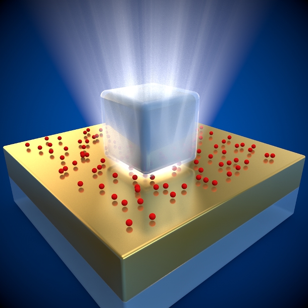 An illustration of the new superfast fluorescent system. The silver nanocube sits on top of a thin gold foil, with red quantum dots sandwiched between.